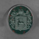 A man's stone crest ring in Bloodstone.