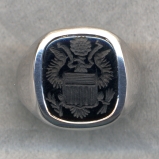 A man's stone ring with the Great Seal of the United States.