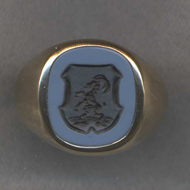 An old stone ring where we simply engraved family crest on the existing stone.