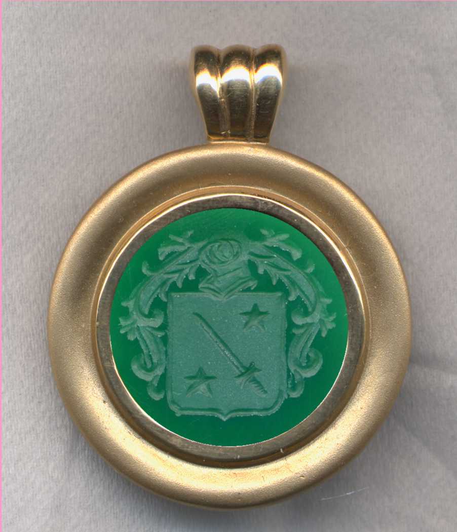 A stone (Green Onyx) Family Crest (Coat of Arms) Pendant.