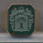 A 14k gold and Bloodstone signet ring engraved with a Family Crest or Coat of Arms.